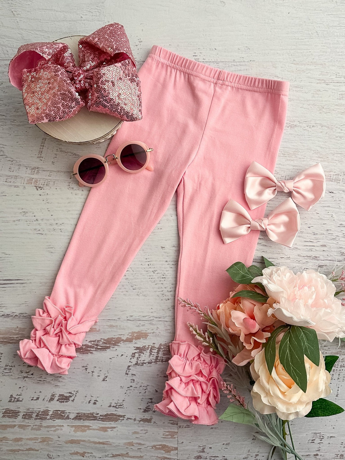 Light pink ruffle icing leggings