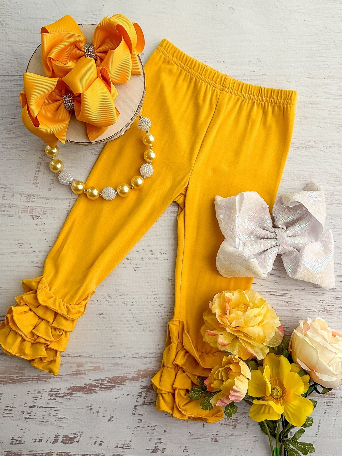 Mustard ruffle icing leggings
