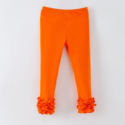 Orange leggings with ruffled cuffs on a white background