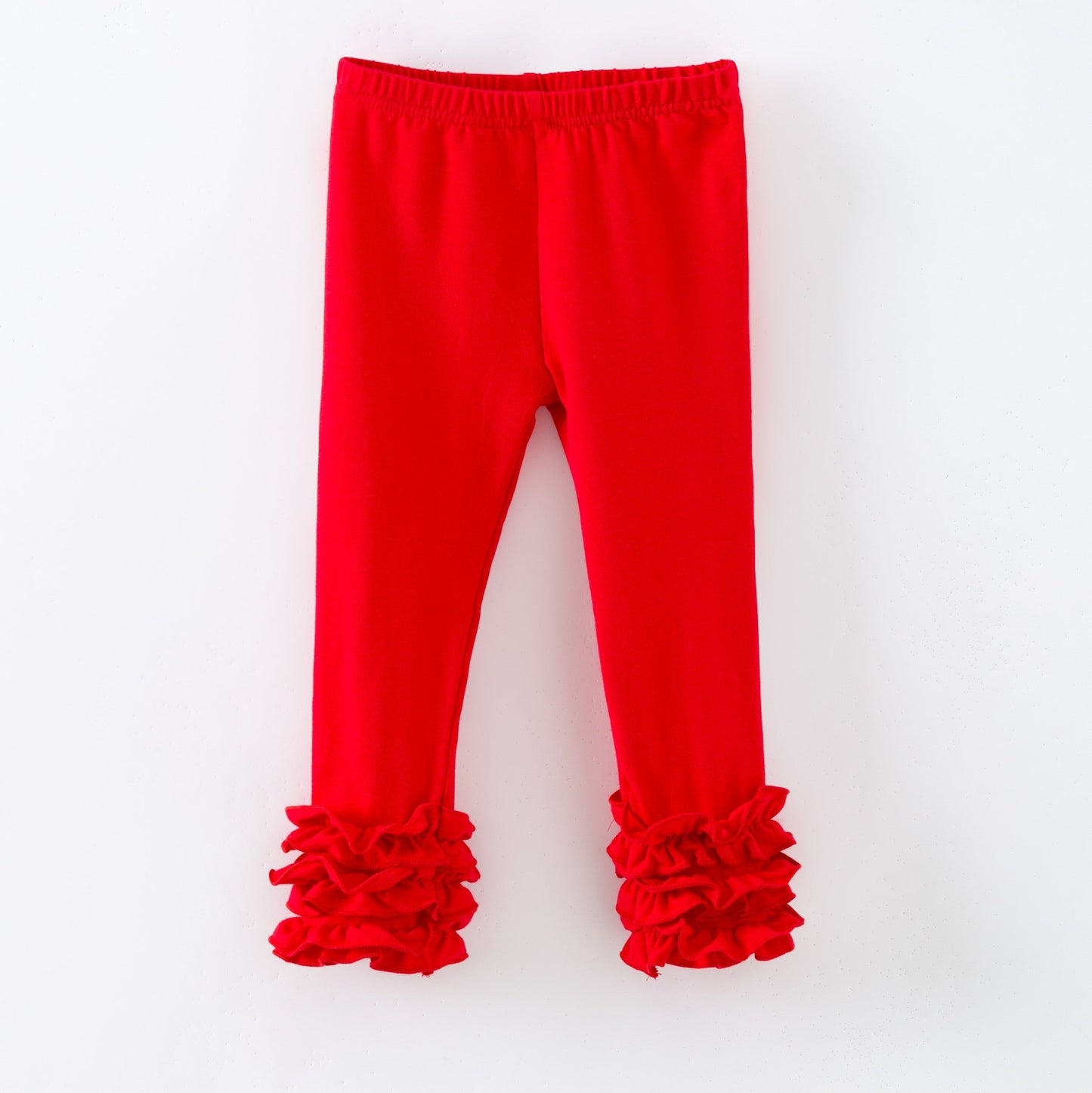Red leggings with ruffled cuffs on a white background