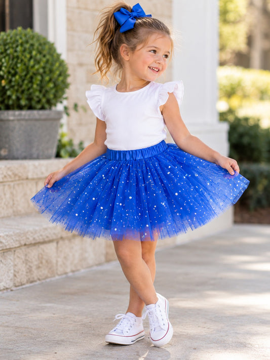 Girl in a sparkle tutu on a front porch