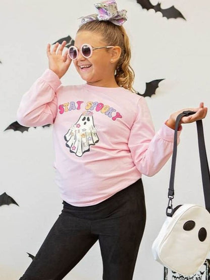 Girl wearing the Stay Spooky Ghouls top