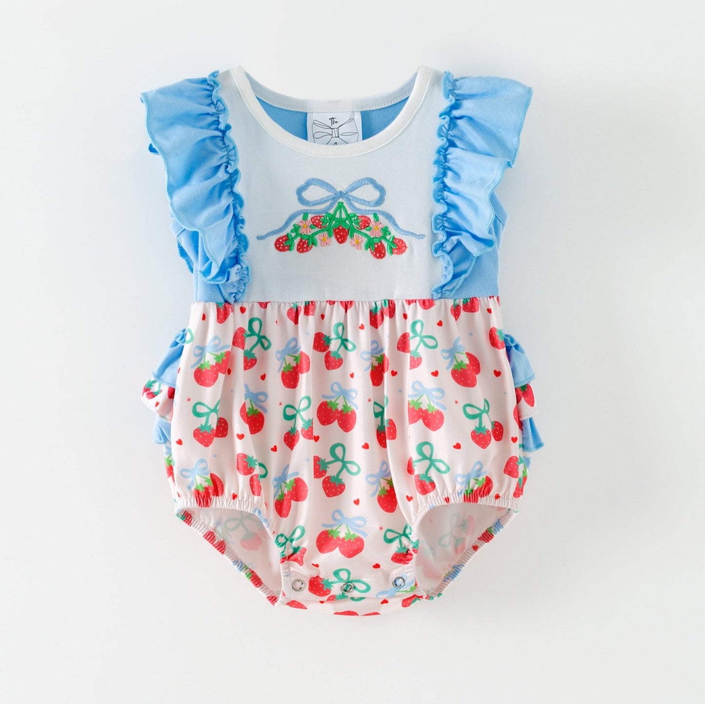 Baby romper with blue ruffled sleeves and cherry pattern on a white background