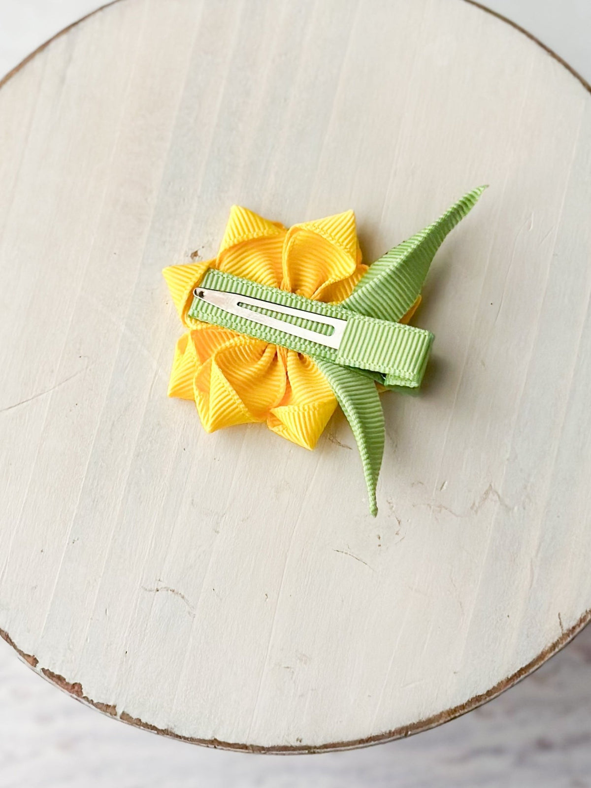 Back of sunflower clippie showing single prong alligator clip