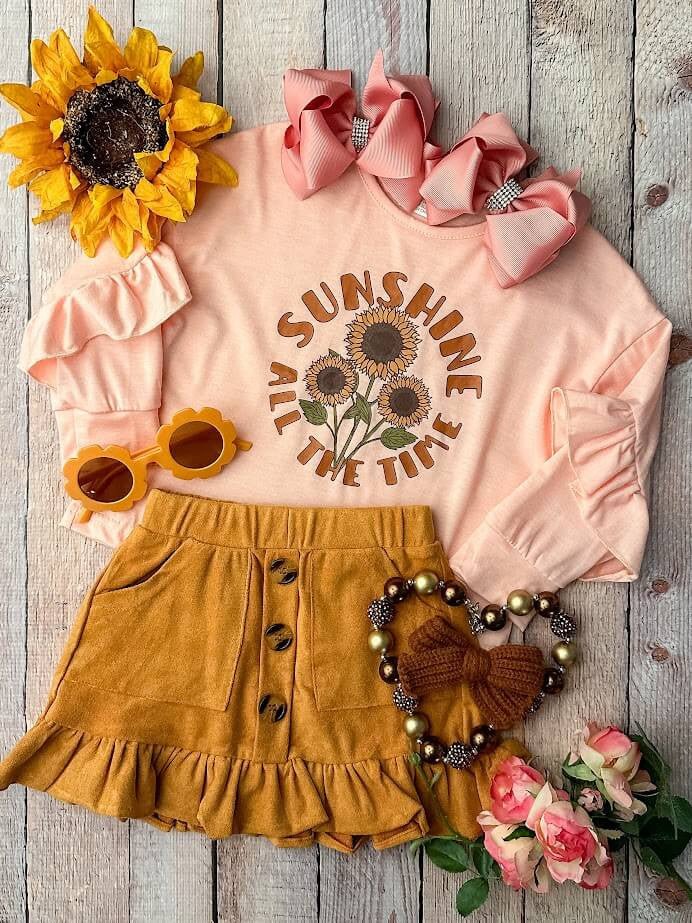 Peach Long Sleeve Top With Sunflowers, & Mustard Button Skirt.