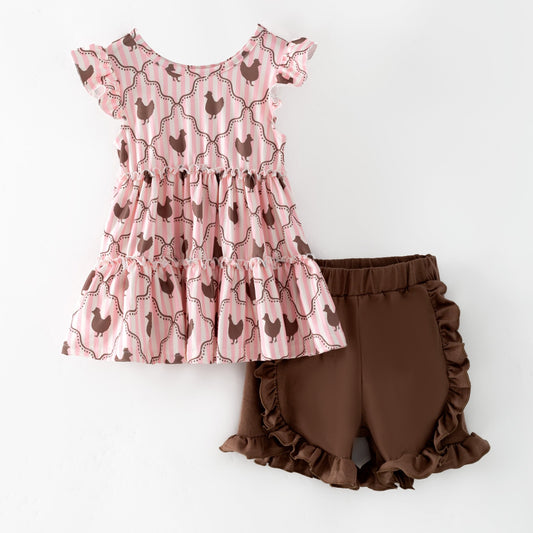 Pink ruffled top with chicken pattern and brown shorts on a white background - Alternative view