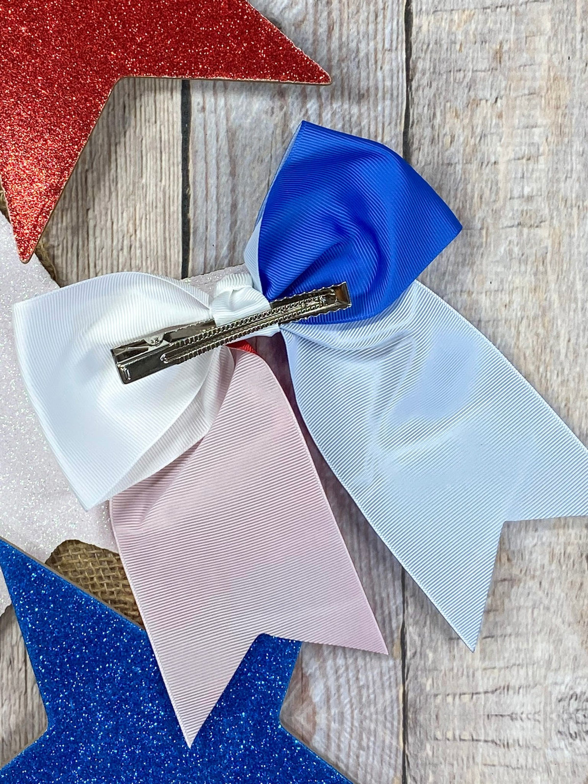 Back of Texas flag embroidered cheer bow showing clip