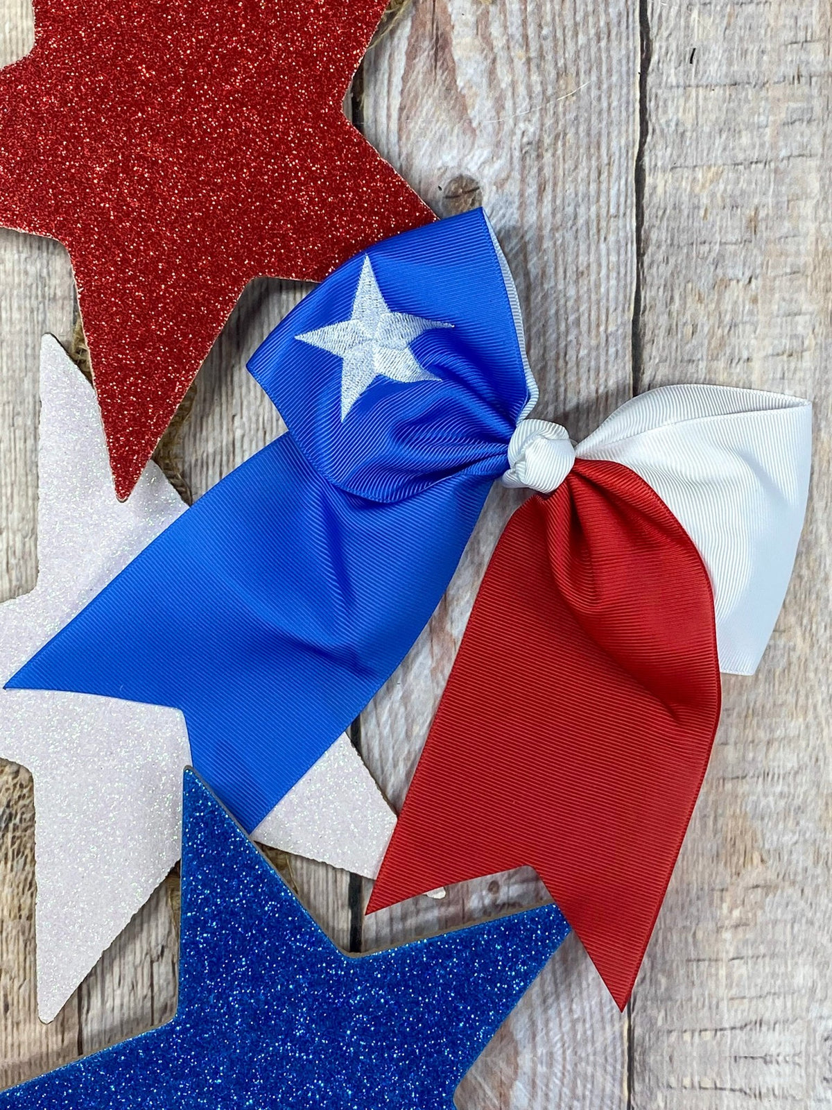 Texas flag embroidered cheer bow on a large clip