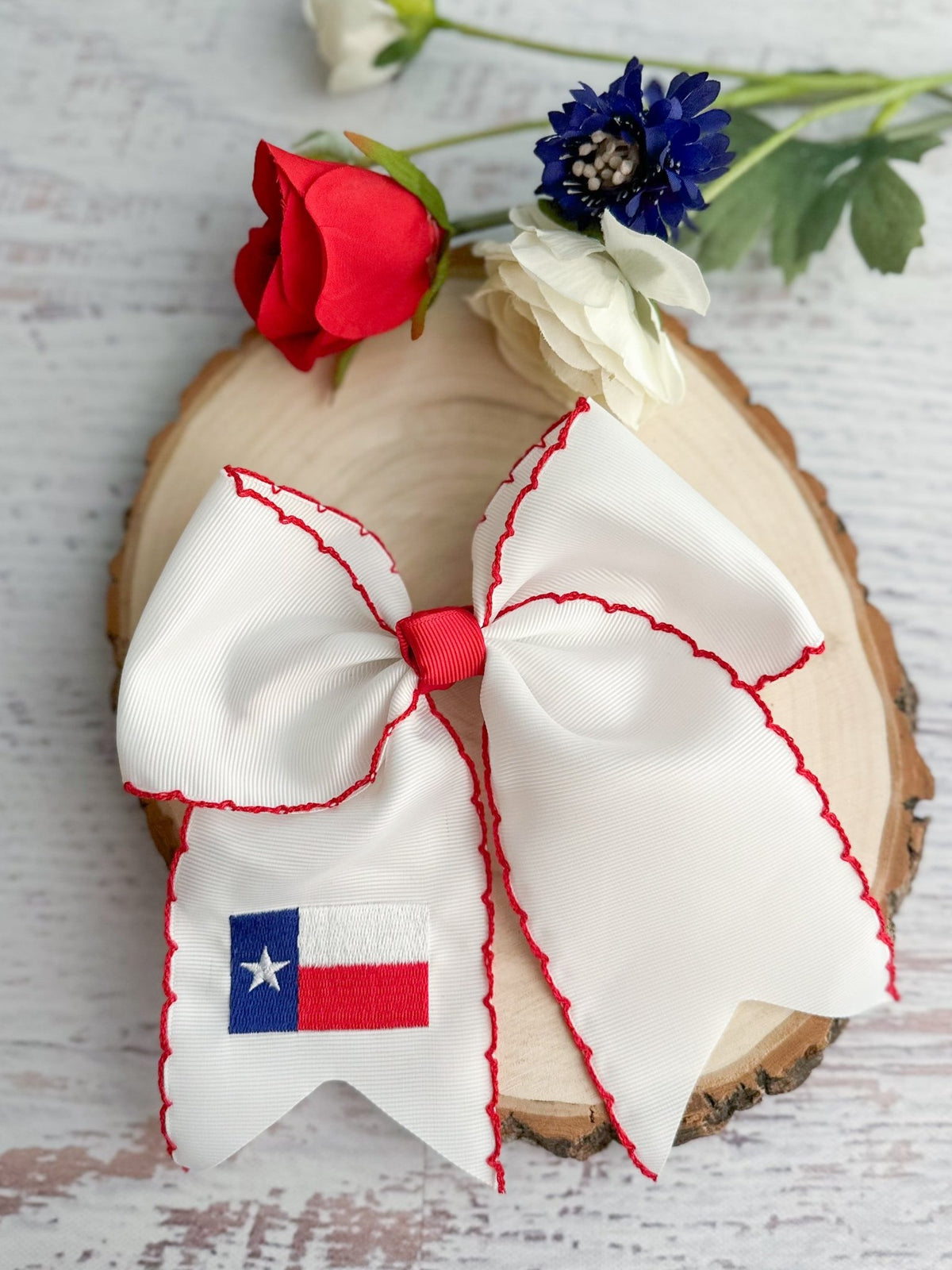 Texas flag embroidered cheer bow with moonstitch trim