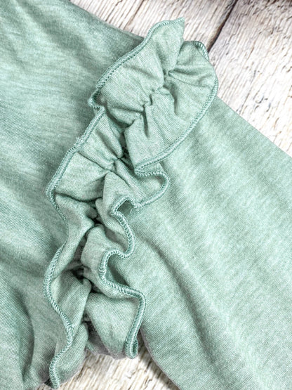 close up of the ruffles on the sleeve/top of shoulder