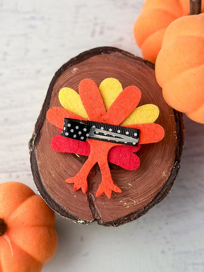 Back of Thanksgiving felt turkey clippie showing alligator clip