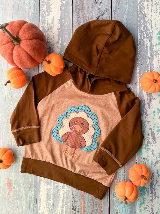 Brown hoodie with a turkey applique and little pumpkins