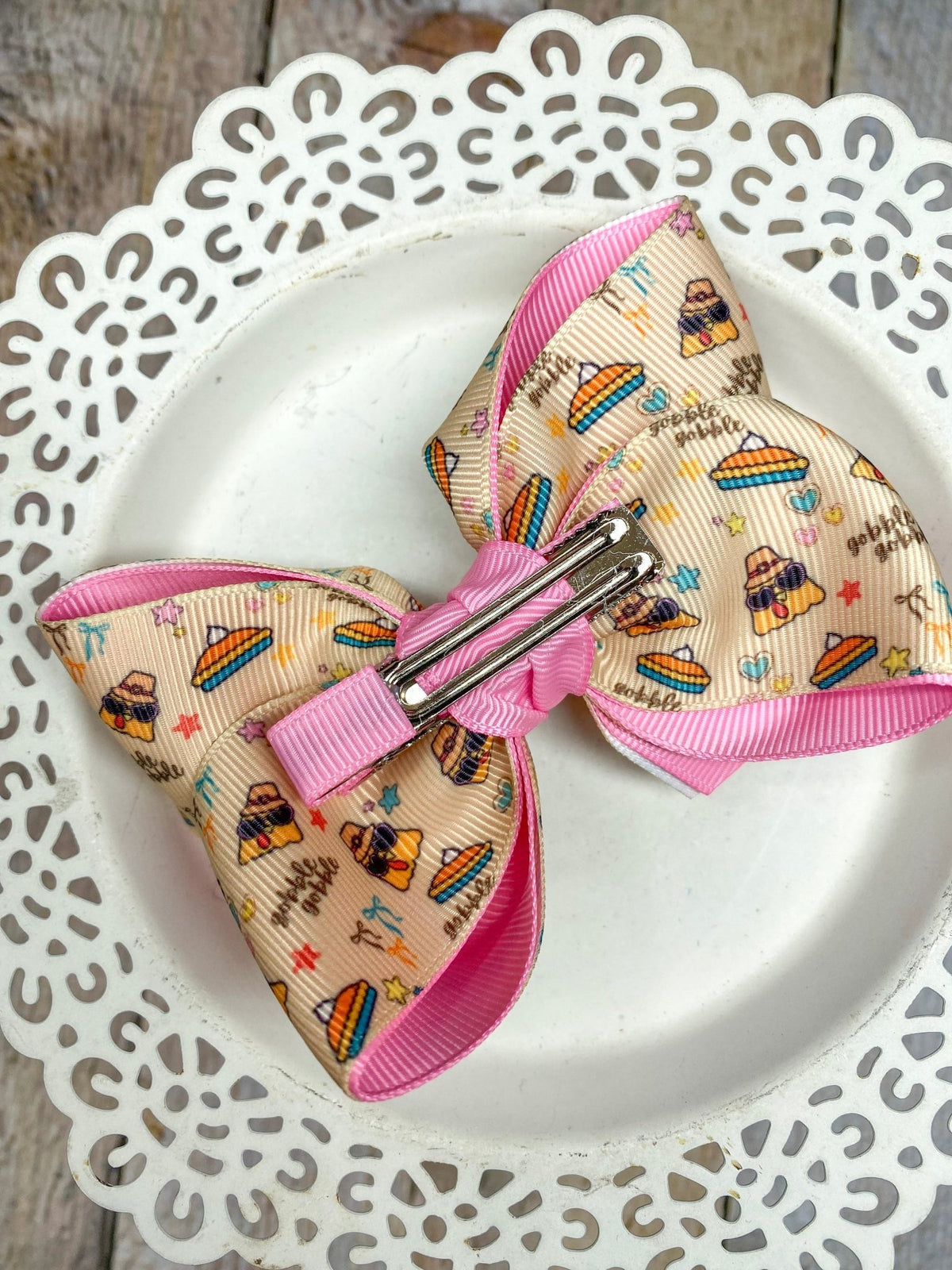 Back of trendy turkey double layer hair bow showing alligator clip
