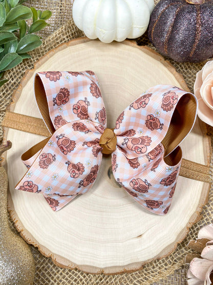 Turkey Print Hair Bow on a wooden background