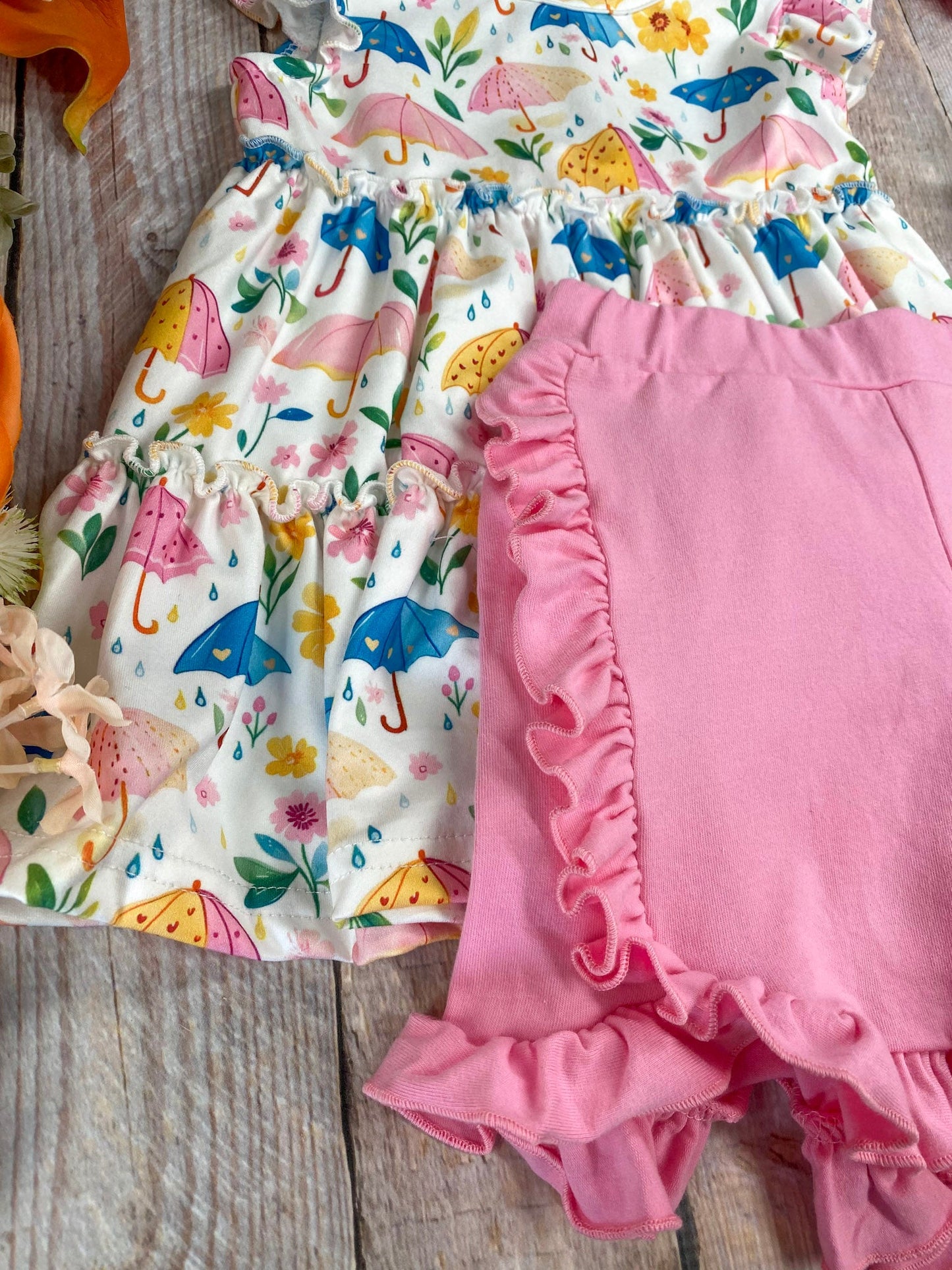 ruffle detail on shorts and umbrella print fabric detail on top