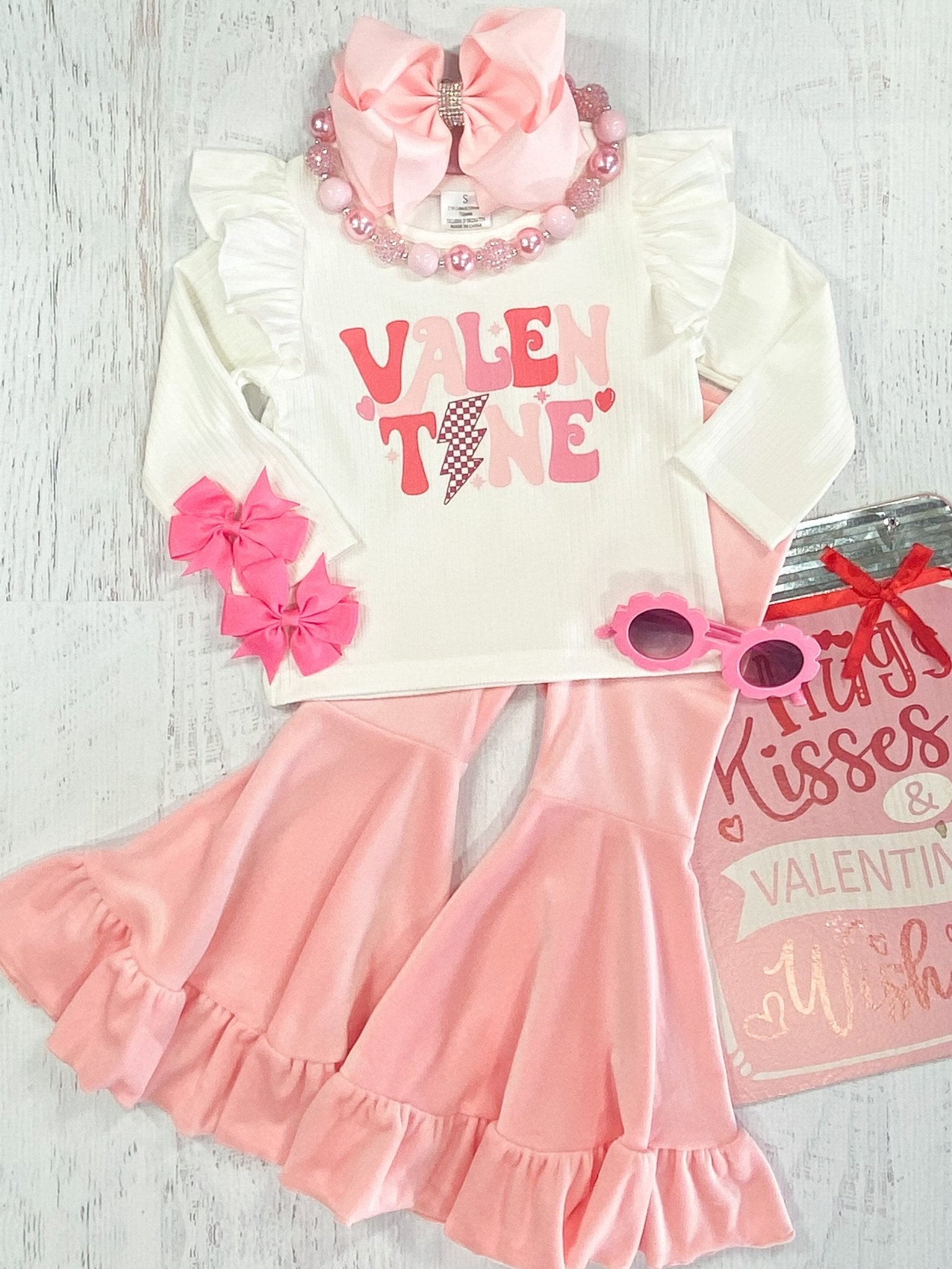 Flatlay of valentine day outfit from The Hair Bow Company