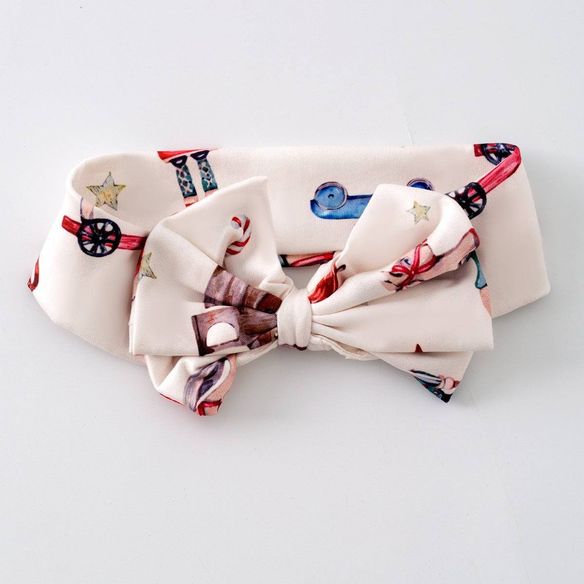 Very Vintage Christmas bow headband with rocking horse and nutcracker print