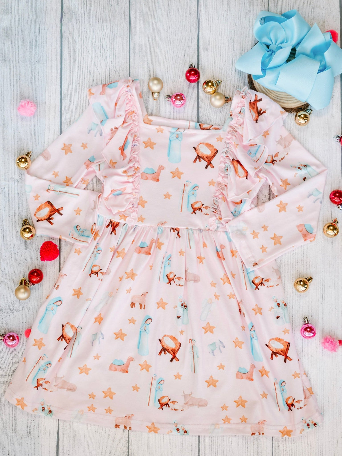 Vintage nativity scene girls twirl dress laid flat with Christmas decorations