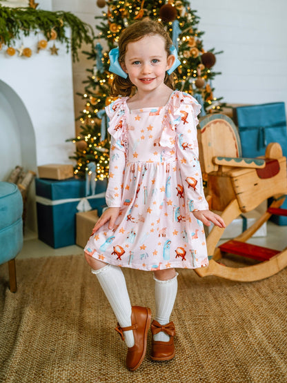 Girl wearing a vintage nativity twirl dress