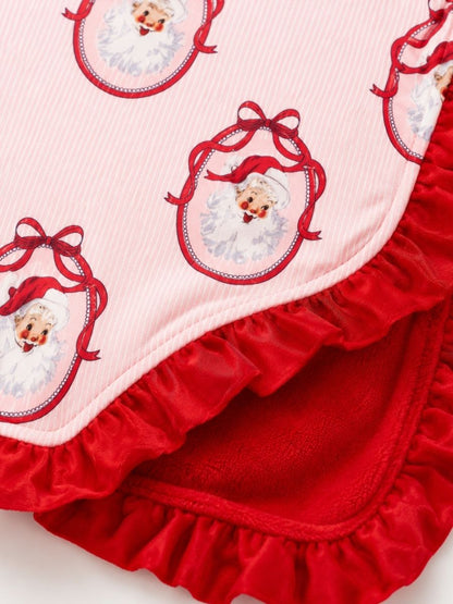 Pink Nutcracker Christmas minky baby blanket with vintage Santa print, soft red plush backing, and elegant ruffle trim.