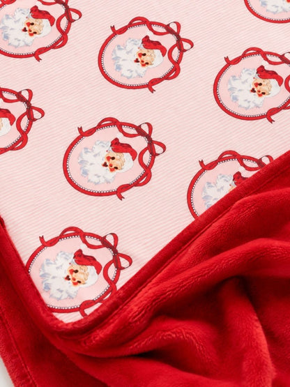 Pink Nutcracker Christmas minky baby blanket close-up featuring vintage Santa print with ultra-soft red plush minky backing.