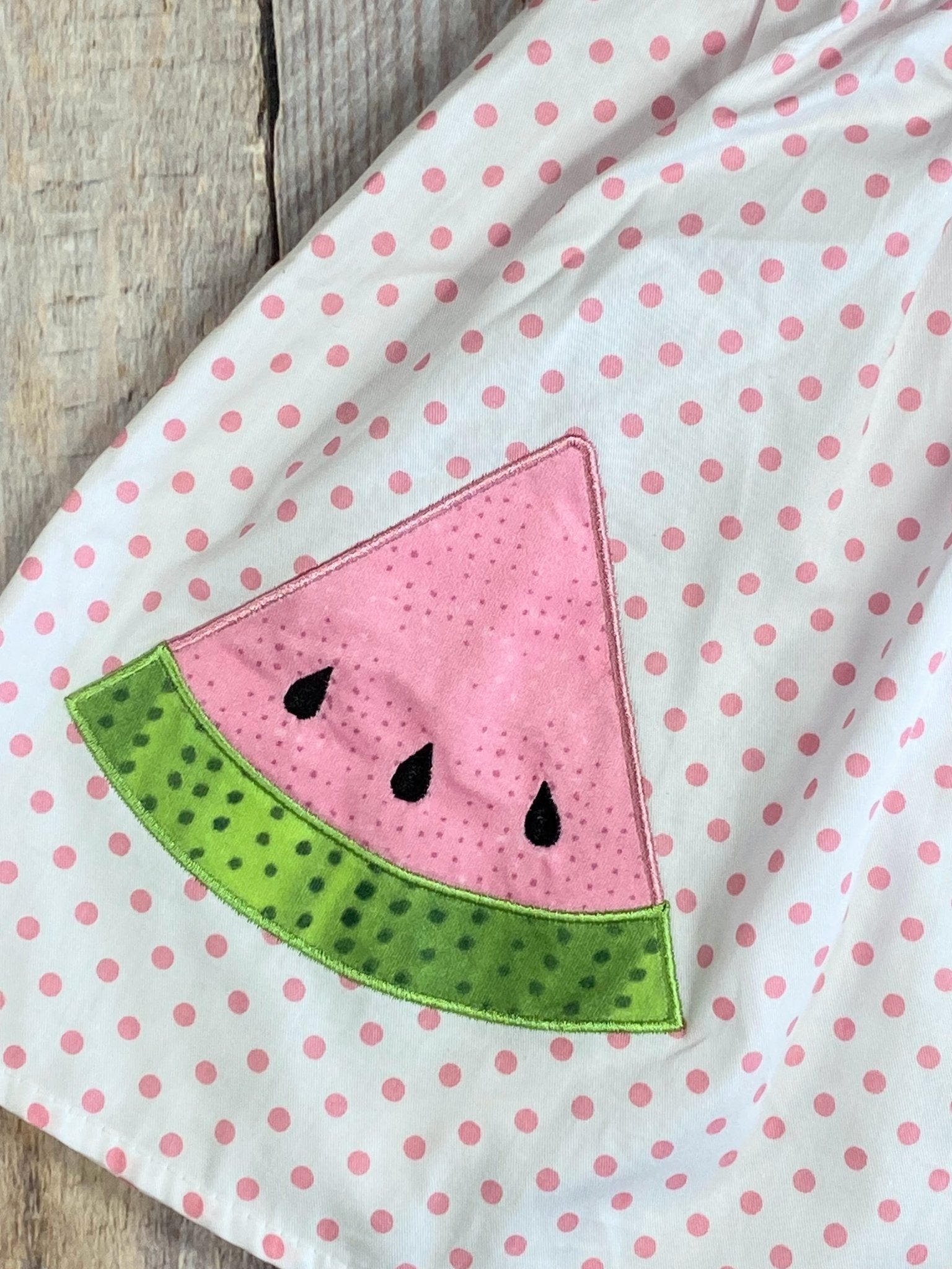 Close up detail photo of watermelon embroidery (this particular photo is of the one on the matching girl's dress, but the embroidery is the same)