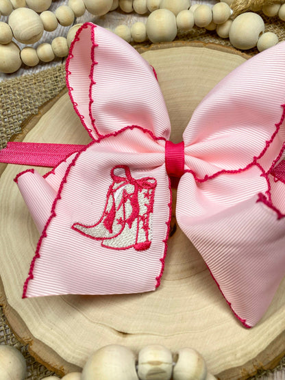 Pink Western Boot Embroidered Moonstitch Headband on a wooden background