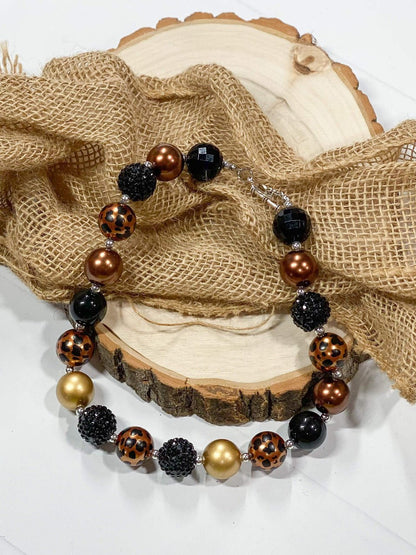 Chunky bead necklace with black, gold and leopard beads