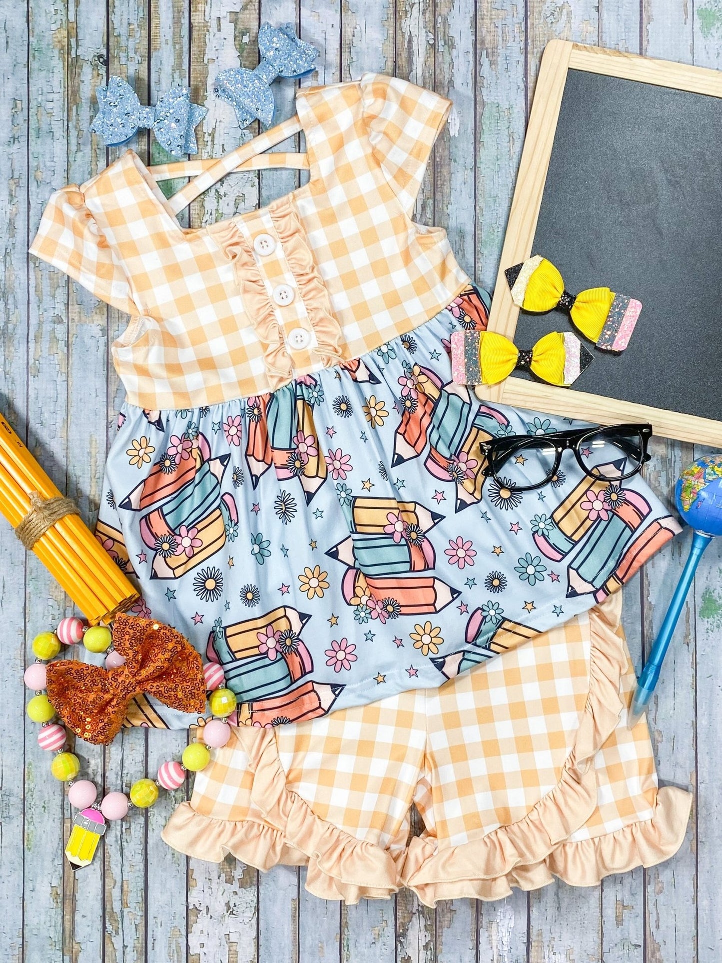 Yellow Gingham and Pencils print ruffled shorts set styled with accessories