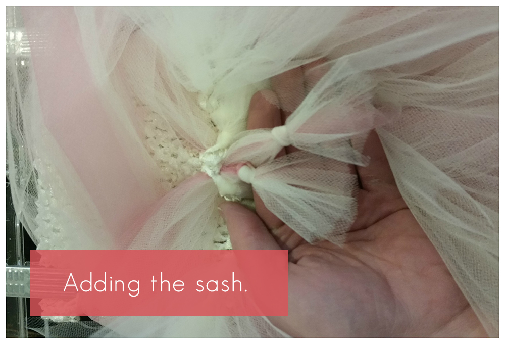 Adding a sash to a DIY flower girl tutu dress.